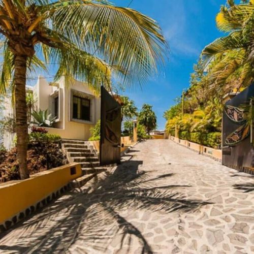 The house features an electric entrance gate, providing privacy and secure access for your Tamarindo stay.