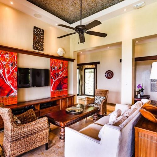 Comfort and style come together in this Costa Rica-inspired living room, perfect for unwinding during your Tamarindo stay.
