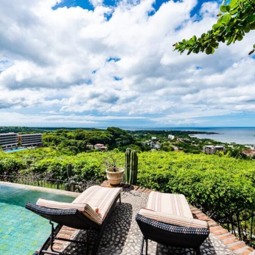 Take in breathtaking views from the pool, overlooking Tamarindo Beach and Langosta Beach in this stunning vacation rental.